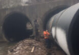 Large Weholite pipe installed underneath a road through a concrete culvert.